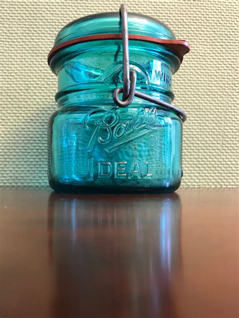 Ball Jars. Rare Antique Green Ball Mason Triple L Jar. Ball jars are one of the most recognized brands of vintage canning jars. Aqua Ball quart jars made from 1900-1910 with shoulder seals are worth $15-$18, while half-gallon jars made from 1910-1923 with the same seal can be worth $25-$30.